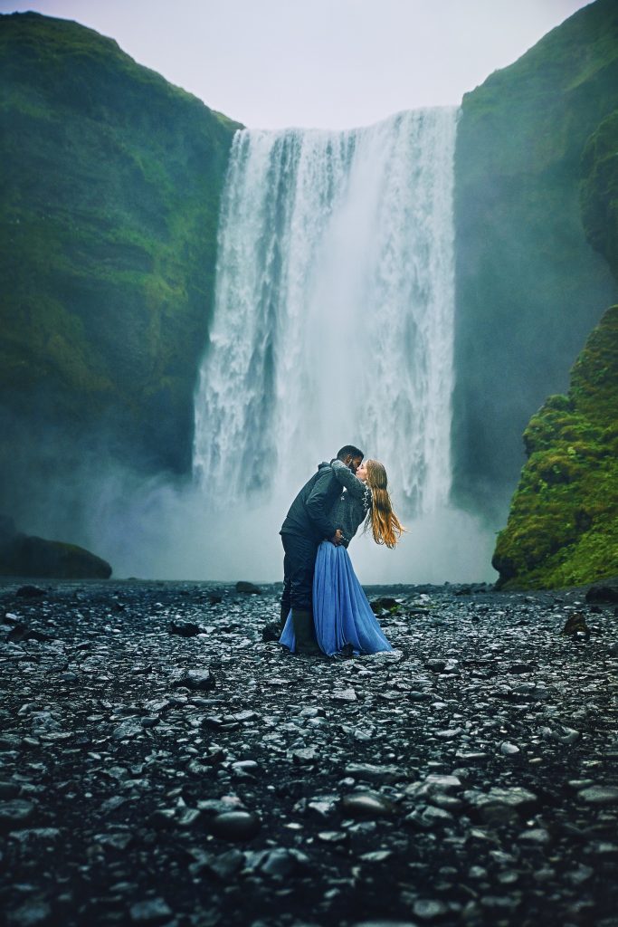 Victoria Yore And Terrence Drysdale Kissing at Skogafoss Waterfall In Iceland