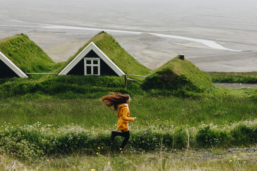 woman running along quotes about iceland