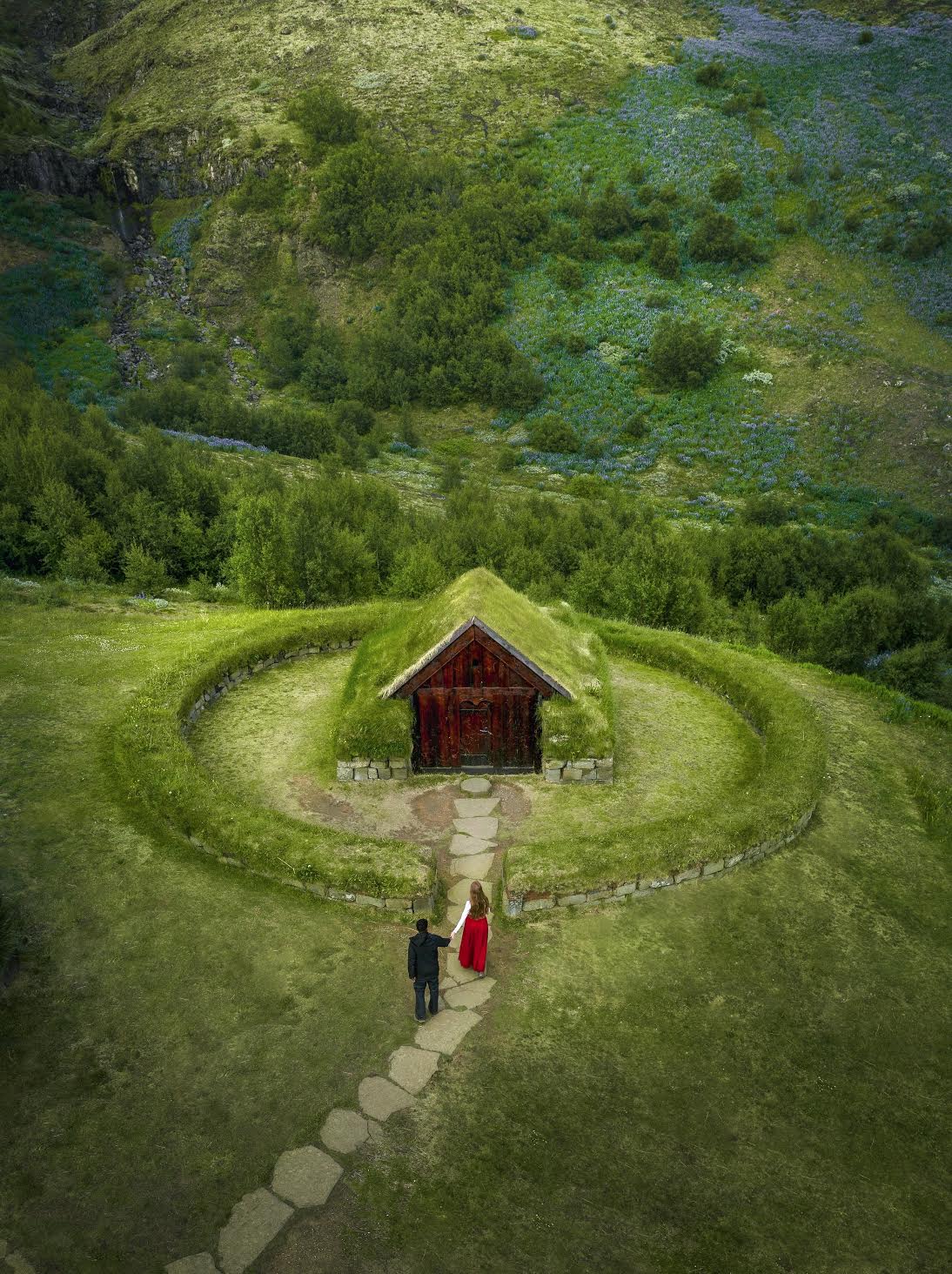 Thjodveldisbaerinn Farm from above with two people walking during your 4 days in Iceland