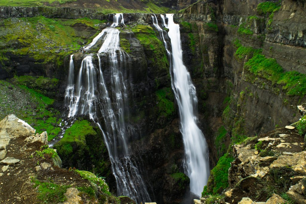 View looking down at the split waterfall cascading into a canyon.