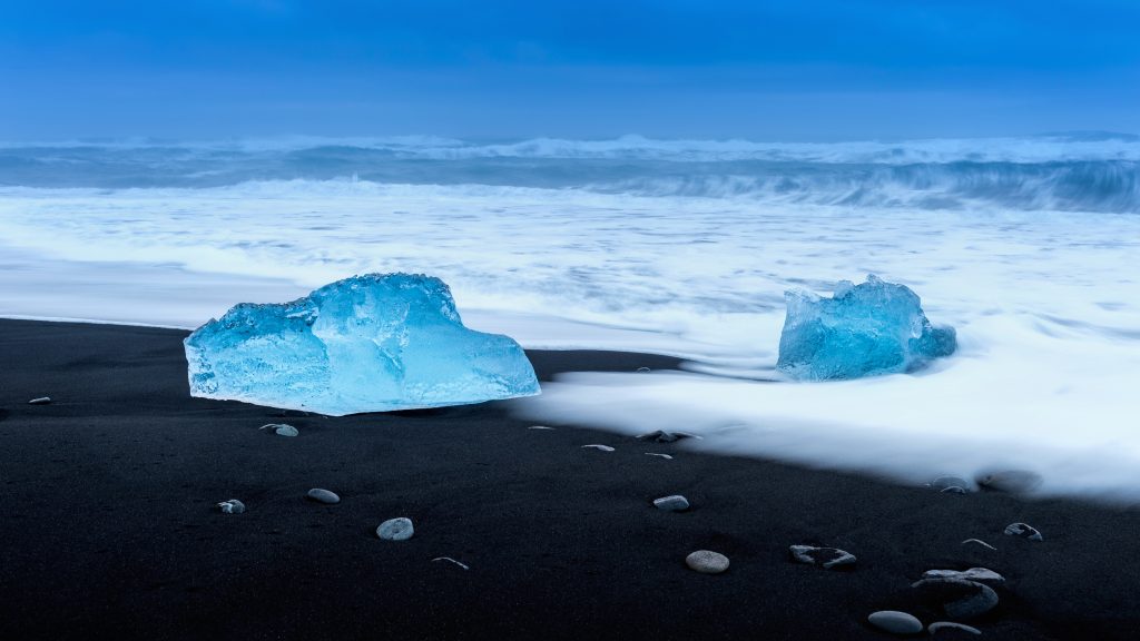 chunks of ice on diamond black sand beach