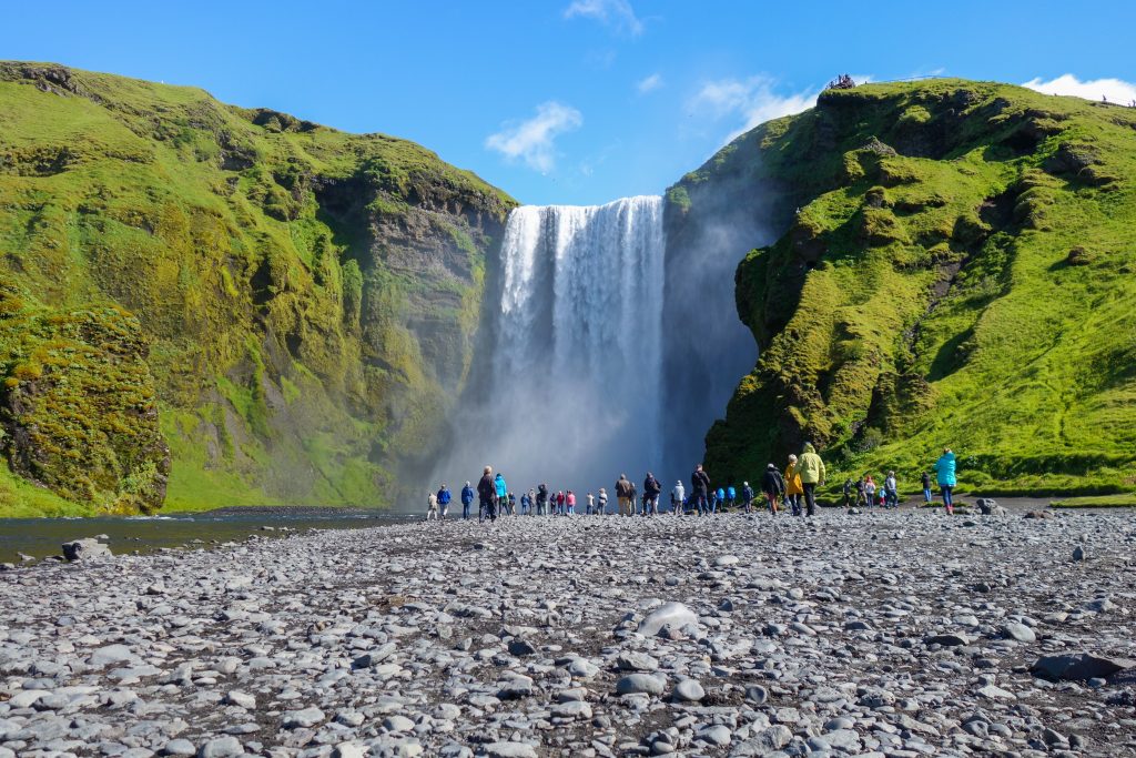 Photo of a guided tour at Skogafoss waterfall in Iceland. 