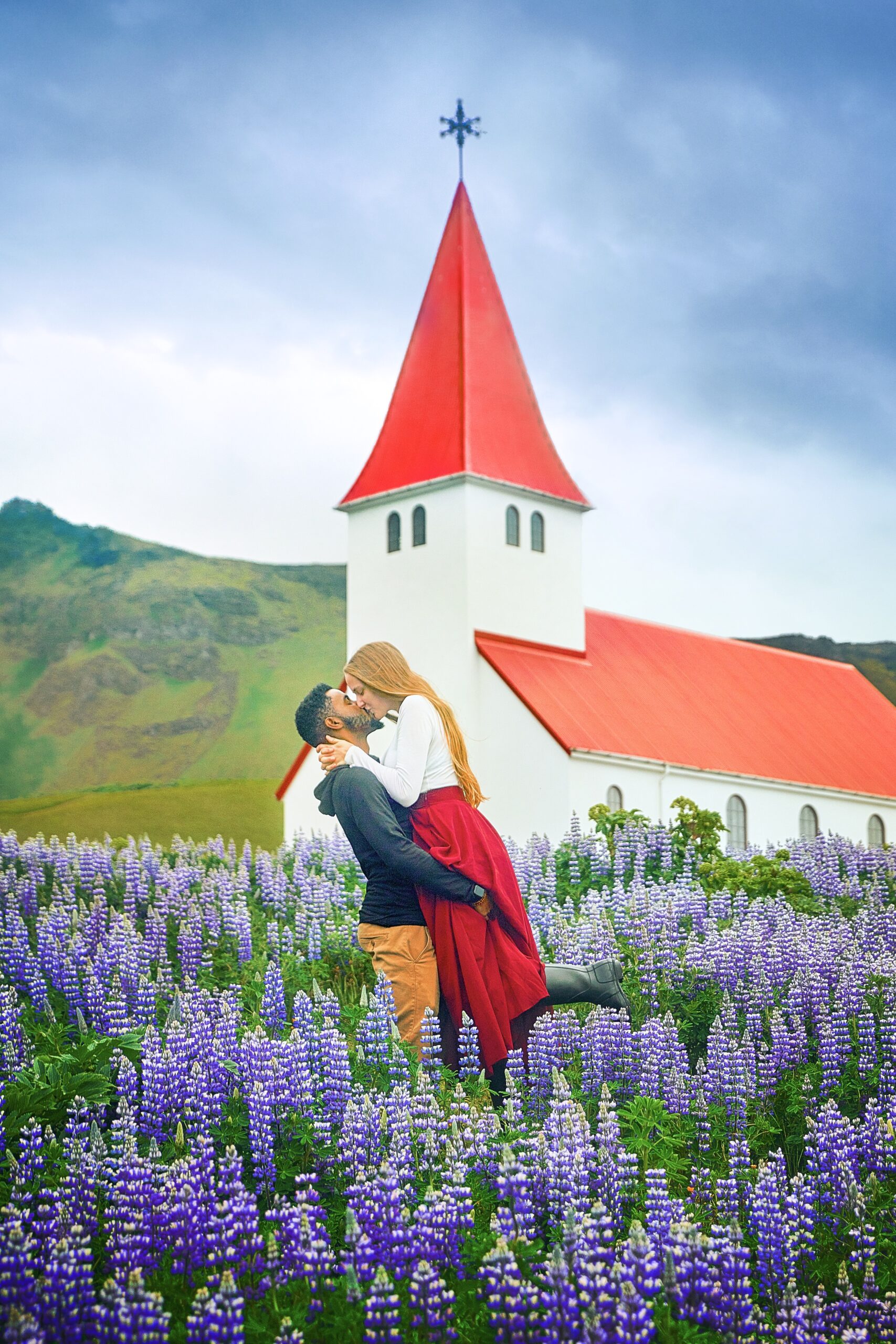 Photo of Victoria and Terrence in front of church in Iceland.