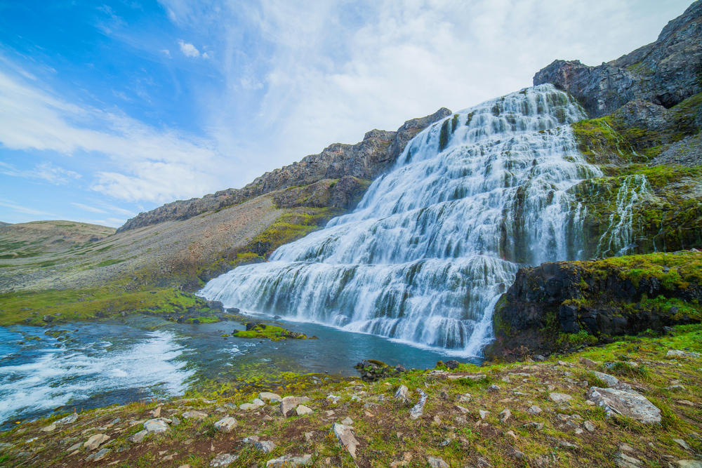 An impressive large Iceland waterfall that looks like a veil on the hillside