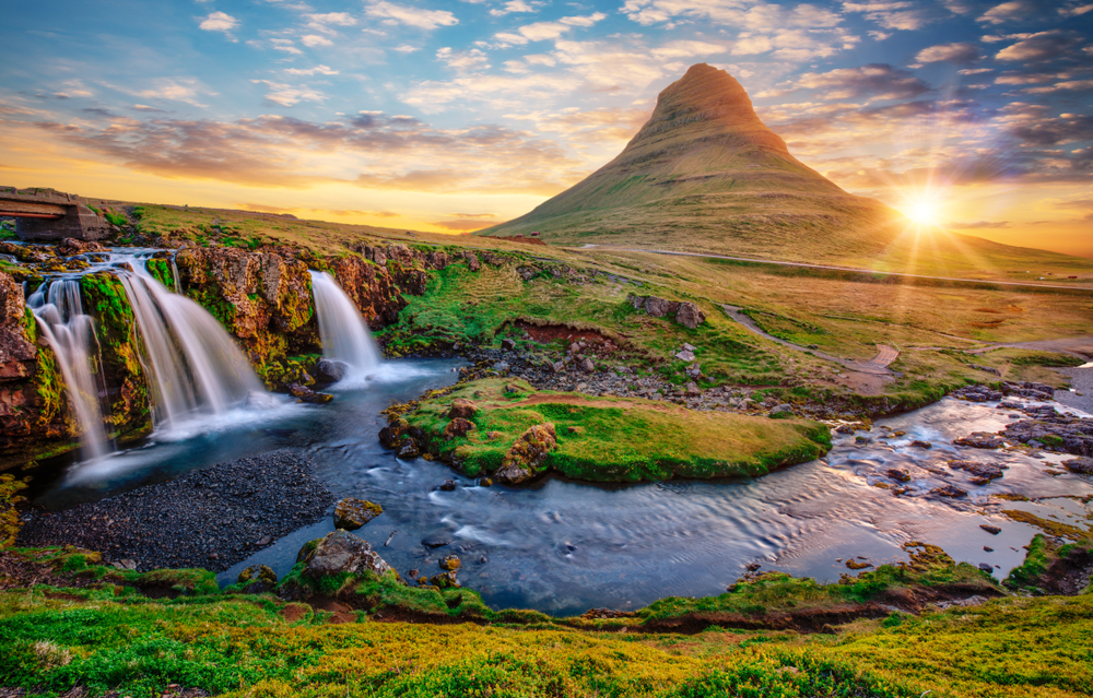 The beautiful waterfall of Kirkjufellsfoss with an impressive mountain in the background