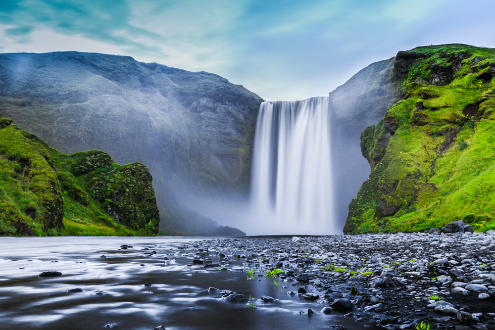 Reykjavik Day Trips Skogafoss Waterfall on a nice sunny day with no people in the image