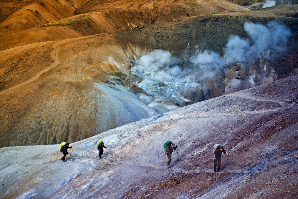 Photo of people hiking. If you want to avoid crowds, the low season is the best time to visit Iceland.