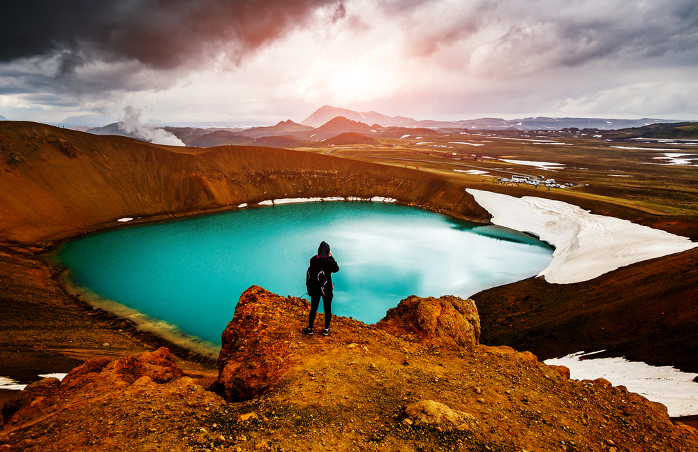 person at kerid crater during their tour in iceland