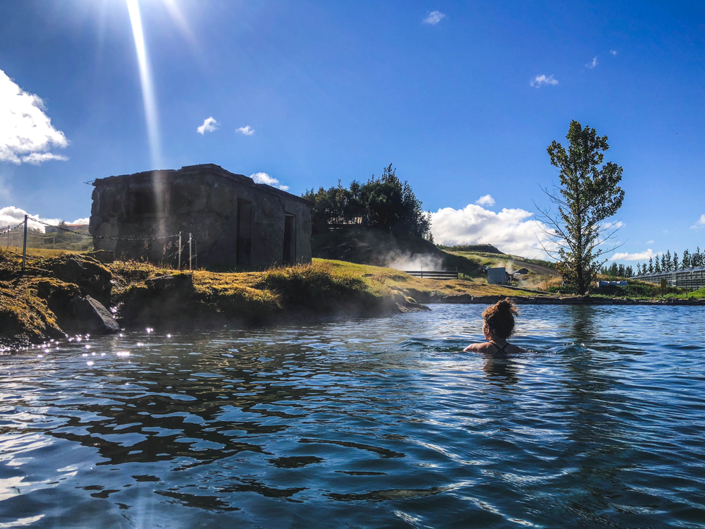 Woman soaking in the Secret Lagoon in Iceland.