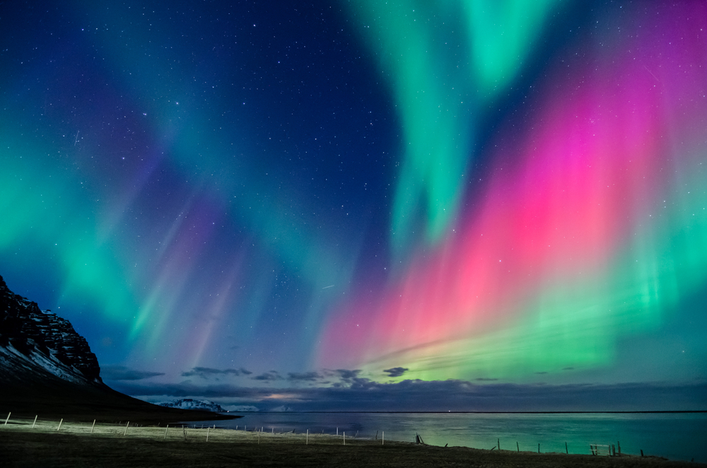 Northern Lights dance across the night sky in Iceland.