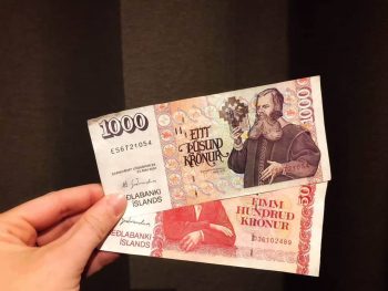icelandic money being held in hand