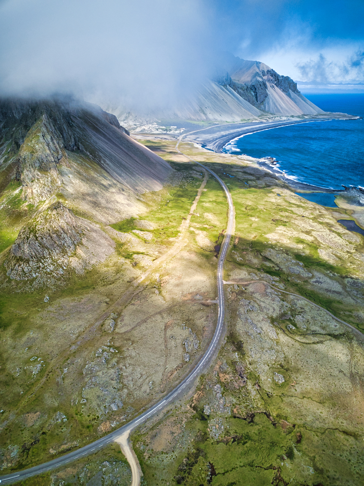 Photo of a waterside road in Iceland.