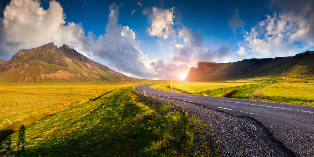 Photo of a sunrise you could glimpse while driving in Iceland.