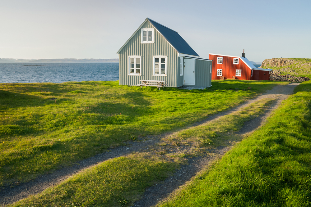 photo of traditional icelandic houses in Flatley island, which is located in one of the national parks in iceland