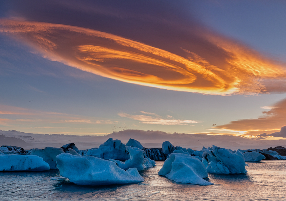 Unique cloud and sunset over glacier lagoon