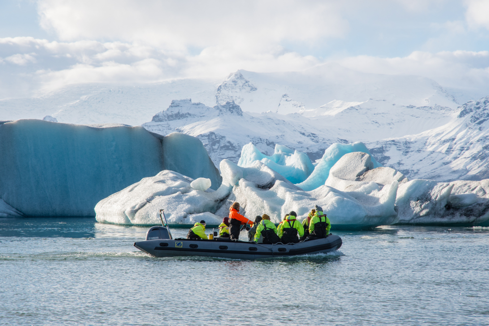 Zodiac Boat tour of jokulsarlon glacier lagoon. Boat close to icebergs.