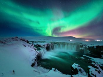 northern lights in Iceland over godafoss