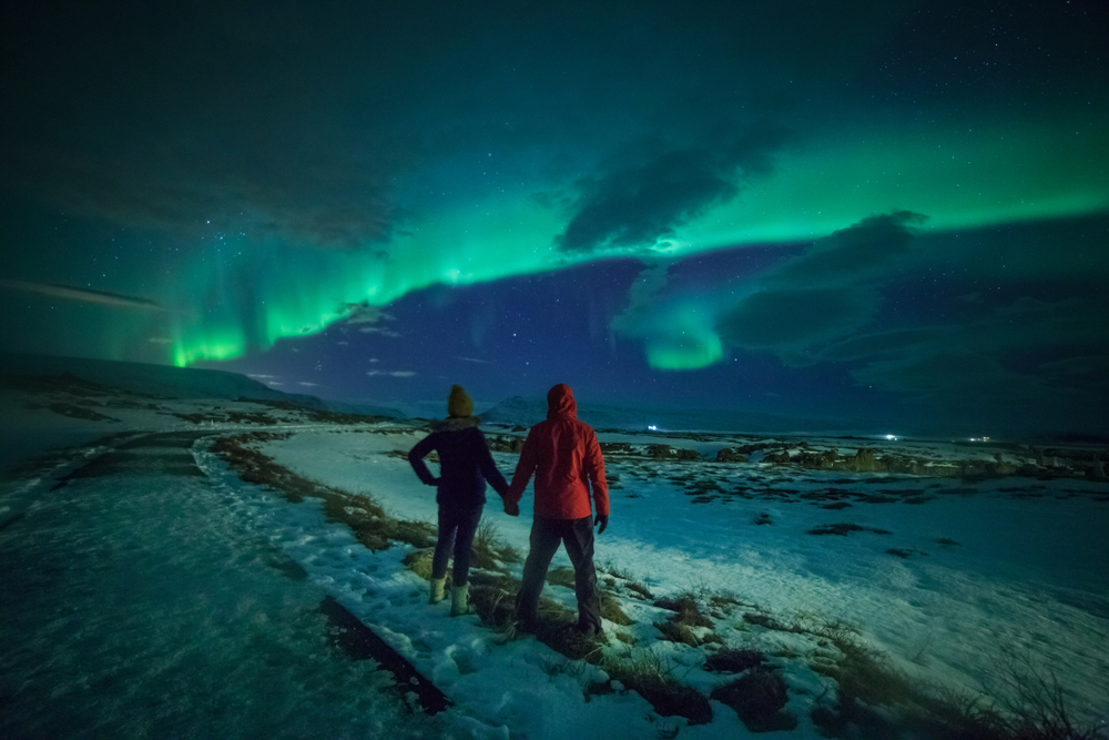 Photo of couple viewing the Northern Lights in Iceland