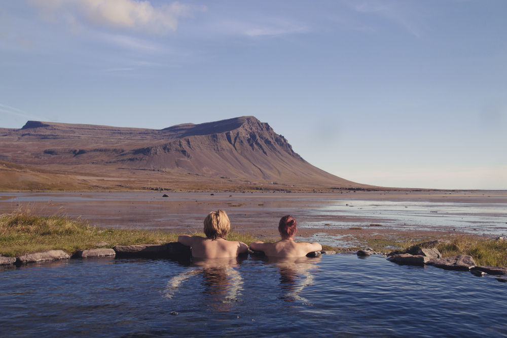 Photo of couple in hot spring in Iceland.