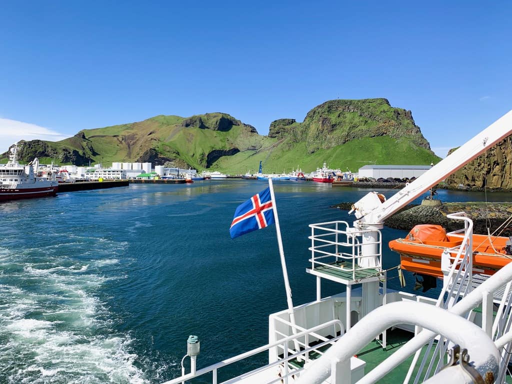 Icelandic flag flying over the Westman Isalnds in Iceland