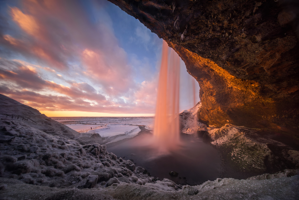 winter in Iceland  Seljalandsfoss waterfall at sunset 