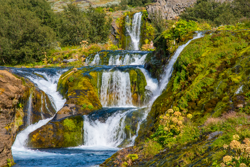 Many layers of waterfalls in the green Gjain Valley.