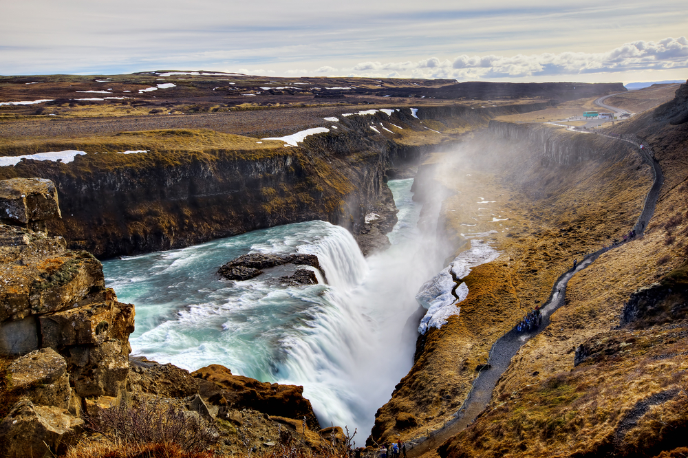 Gullfoss Waterfall cascading into a canyon on a cloudy day.