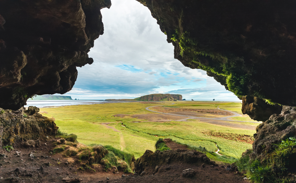 Looking out of the Loftsalahellir Cave at the landscape.