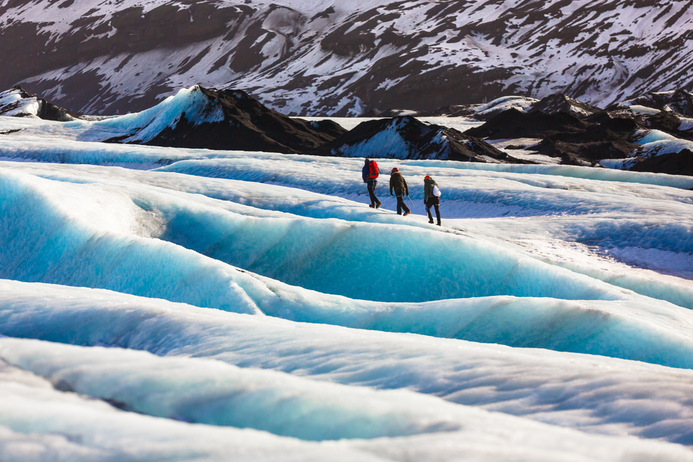 People hiking on Solheimajokull Glacier during 5 Days in Iceland.