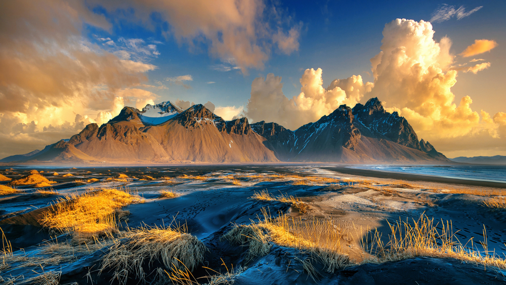 Golden hour over the mountains and black sand beach of Stokksnes during 5 days in Iceland.