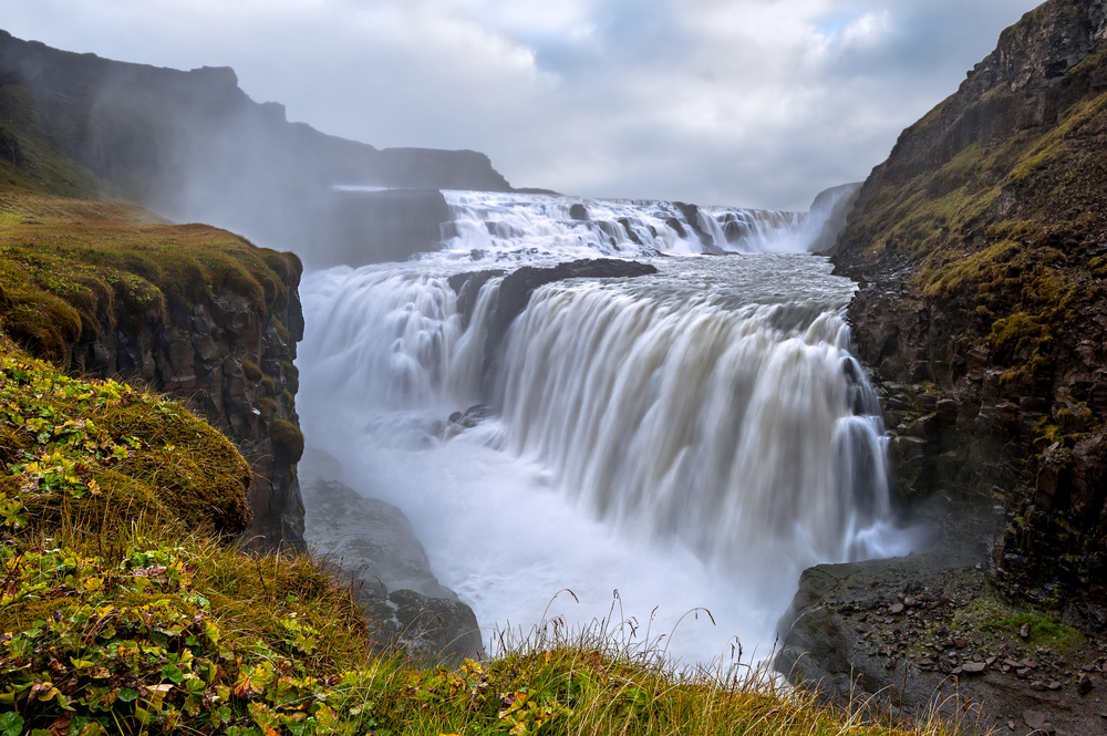 deep in canyon with gullfoss waterfall on a moody day