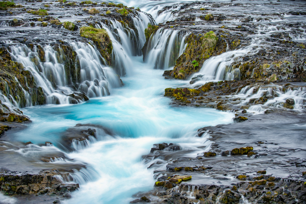 Close up of the cascading blue water.