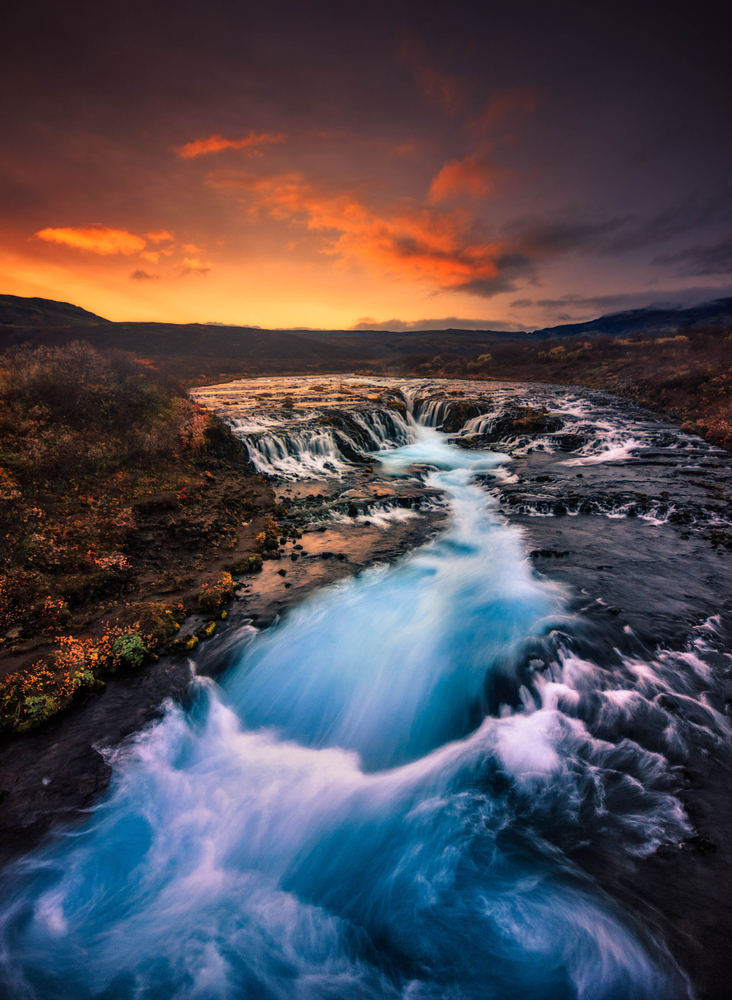 Long exposure photo of Bruarfoss Waterfall at sunset.