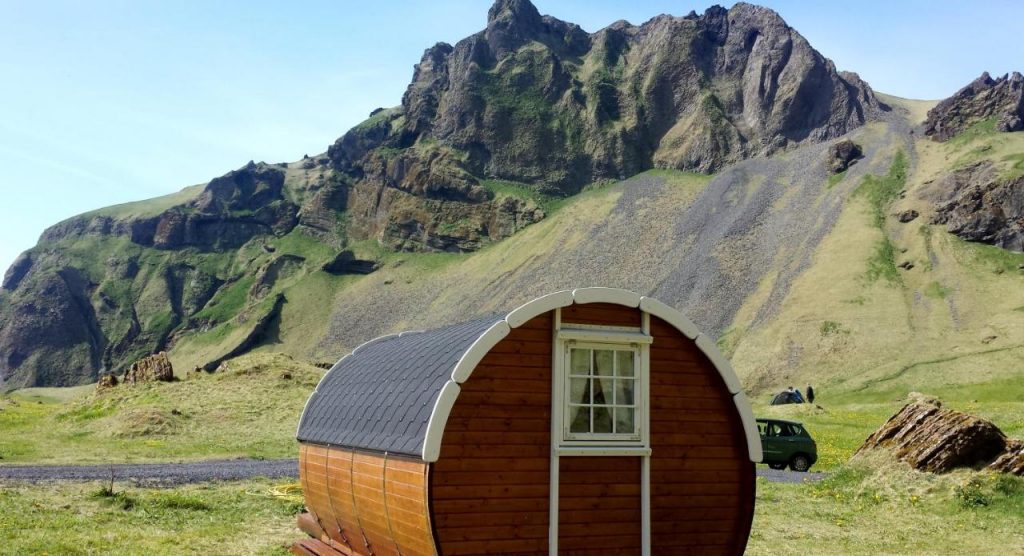 Rounded barrel huts are a good place to go glamping in Iceland for its quaint style and big views