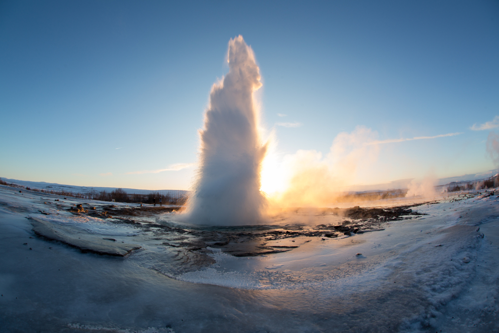 geyser erupting on a winter morning in iceland
