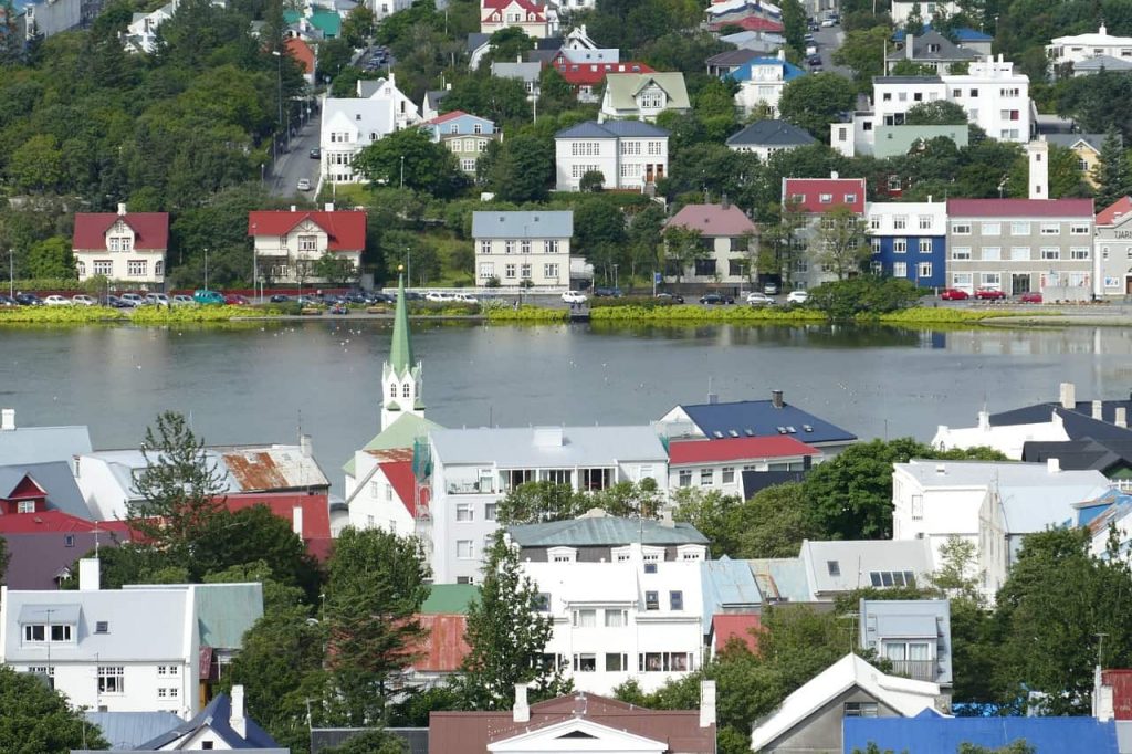 View of a small town in iceland separated by a river