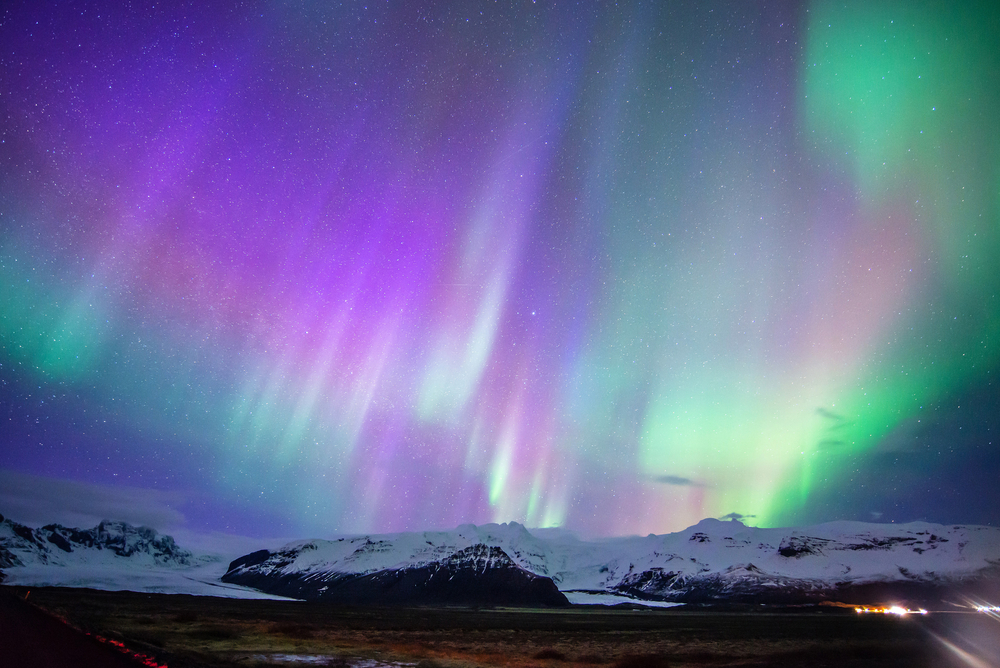 Northern Lights over snow covered mountains