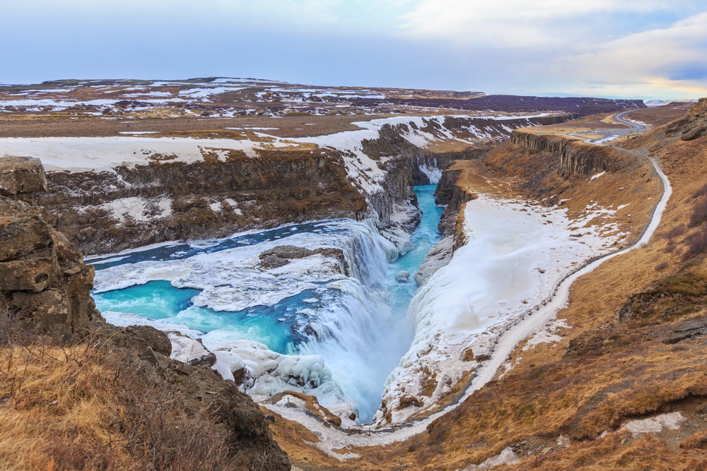 View of Gullfoss Waterfall flowing into a canyon. This is one of the best things to do in Iceland in winter.