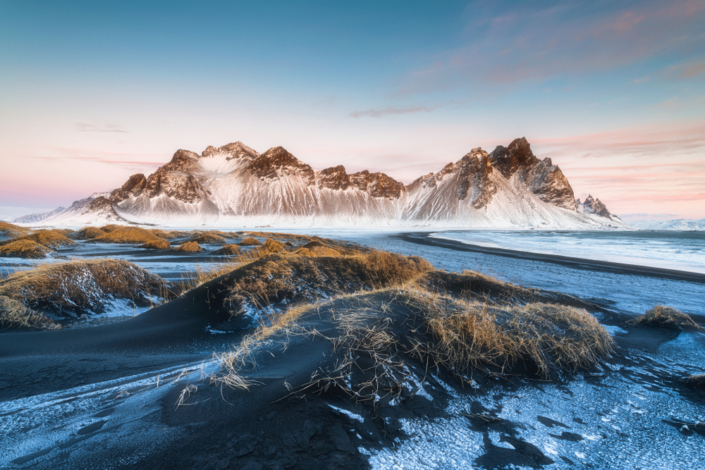The black sand of Stokksnes Peninsula with snowy Vestrahorn Mountain in the background.