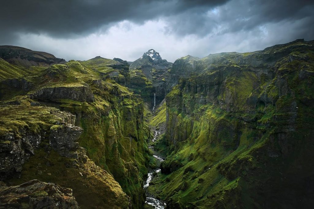 a view down a canyon covered with moss because not walking on the moss is one of the most important Iceland travel tips