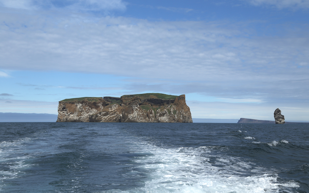 Drangey Island island in the Skagafjörður fjord in northern Iceland. It is the remnant of a 700,000‑year‑old volcano, and is a essentially a massive rock fortress!