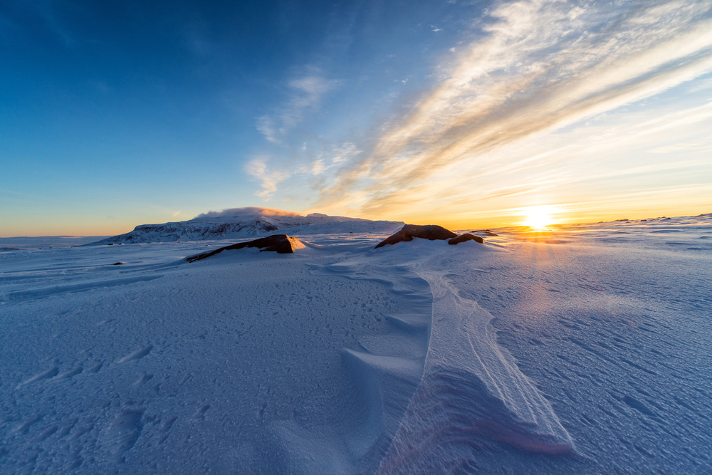 An expanse of snow at sunset at Langjokull Glacier.