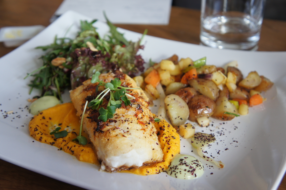 Cod steak on a plate with potatoes