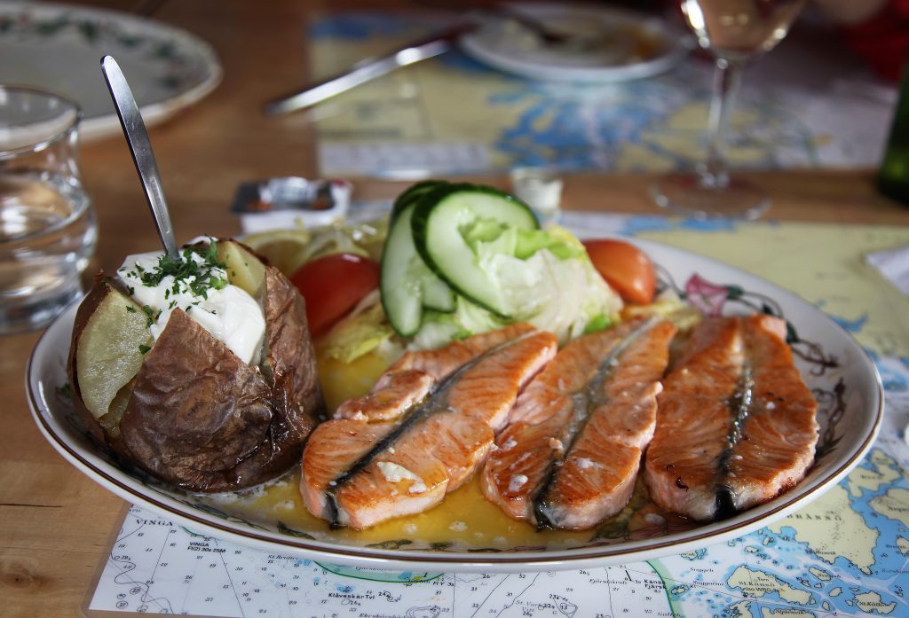 Smoked fish on a plate with potatoes