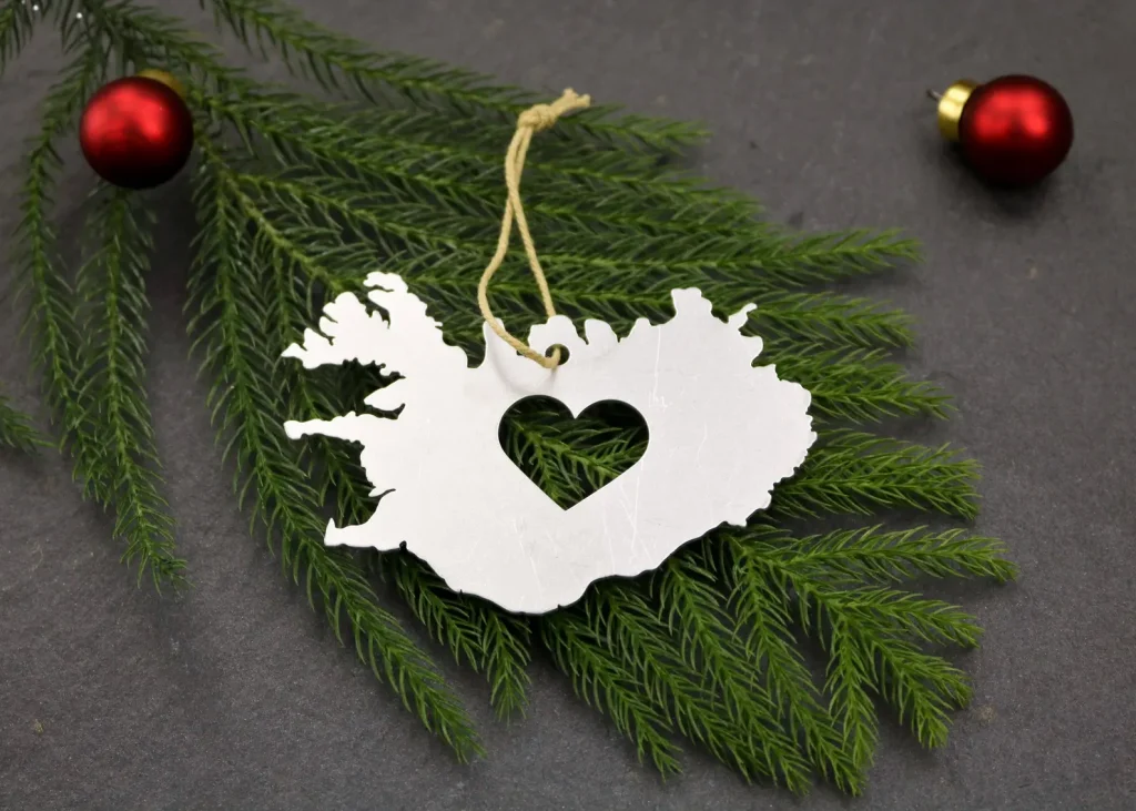 A map of Iceland cut and made into a Christmas ornament. 