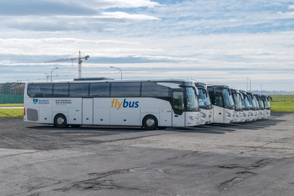 Flybus buses lined up in a parking lot