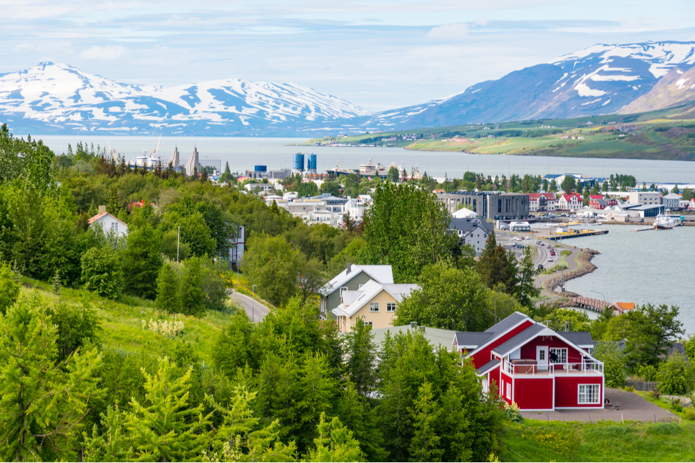Capital of the north, Akureyi with its colorful homes on the water with snowy mountains in the background