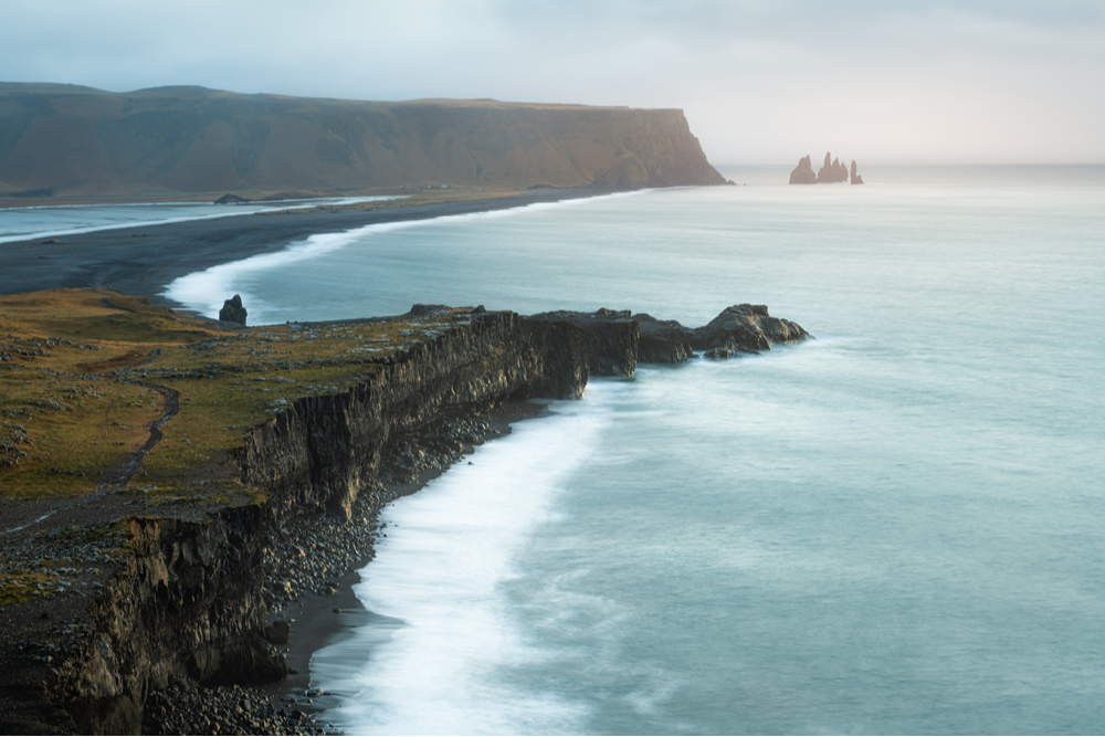 Dreamy blue waters coming to a black sand Reynisfjara beach is the location of Starwars movie filmed in Iceland