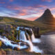 Sunset of Kirkjufell mountain with cascading waterfall nearby is a great location for movies filmed in iceland