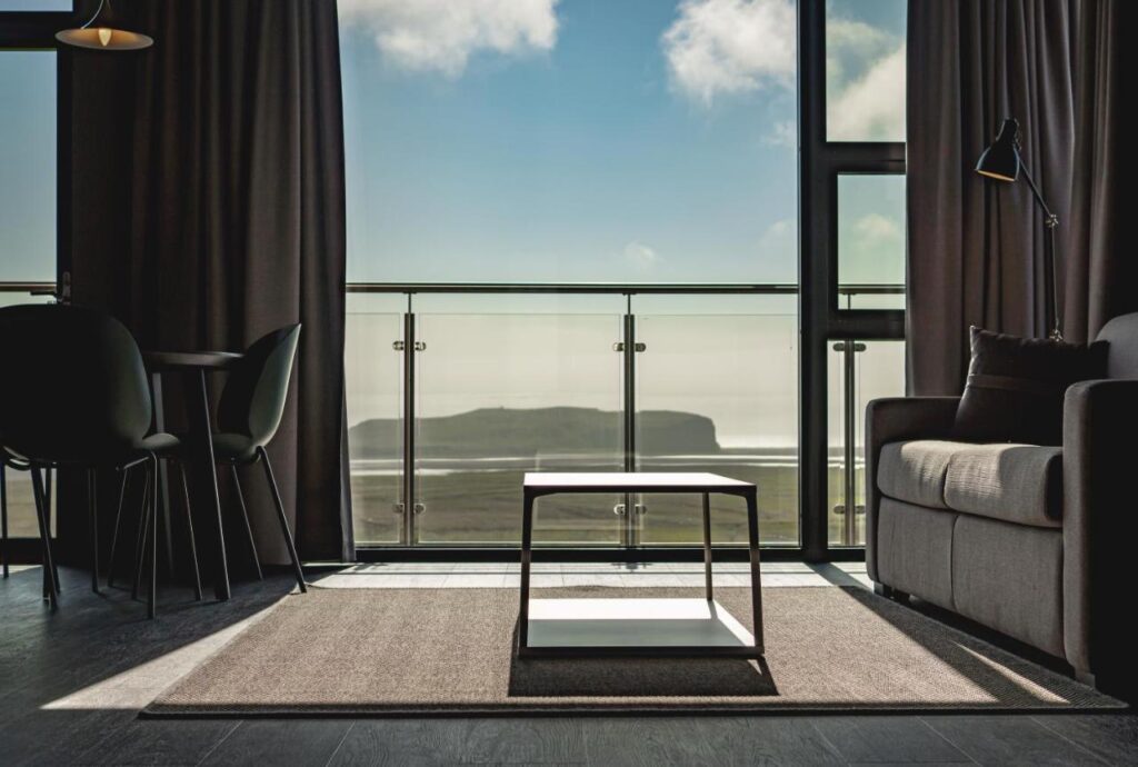 Hotel room with a view of Reynisfjara black sand beach is a great place to stay in iceland